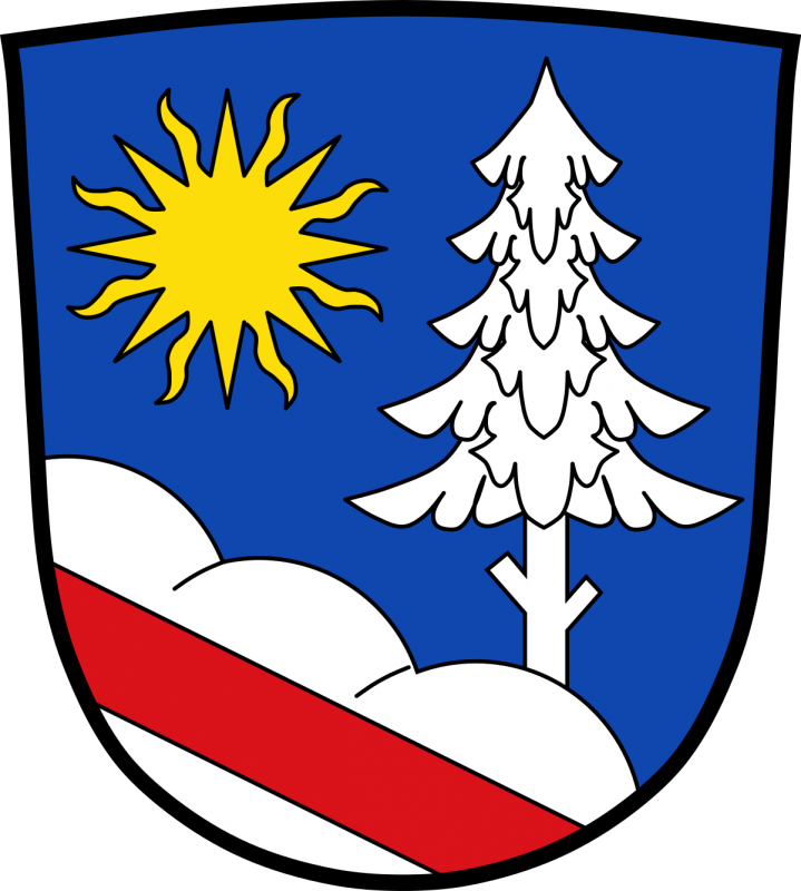 Der rote Balken symbolisiert einen Weg, der eine große Bedeutung für die Entstehung des Ortes hat. Sonne und Baum stellen die Lage im Sonnenwald dar. Die Farben verweisen auf die geschichtliche Verbindung zum Hochstift Passau (rot) und dem Adelsgeschlecht der Wittelsbacher (weiß/silber-blau).